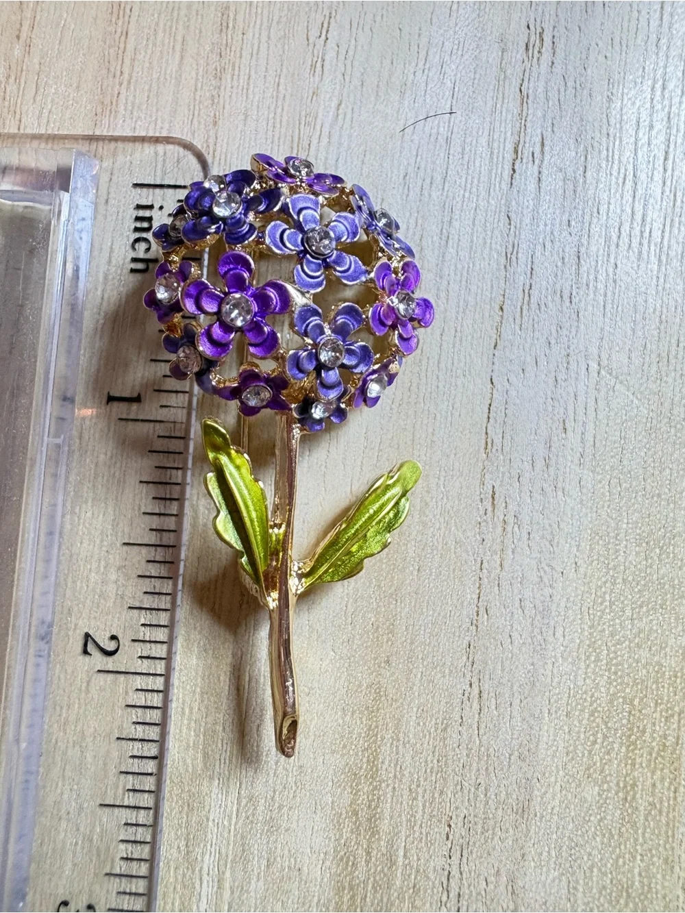 Purple Floral Cluster Brooch with Gold Stem and Green Leaves